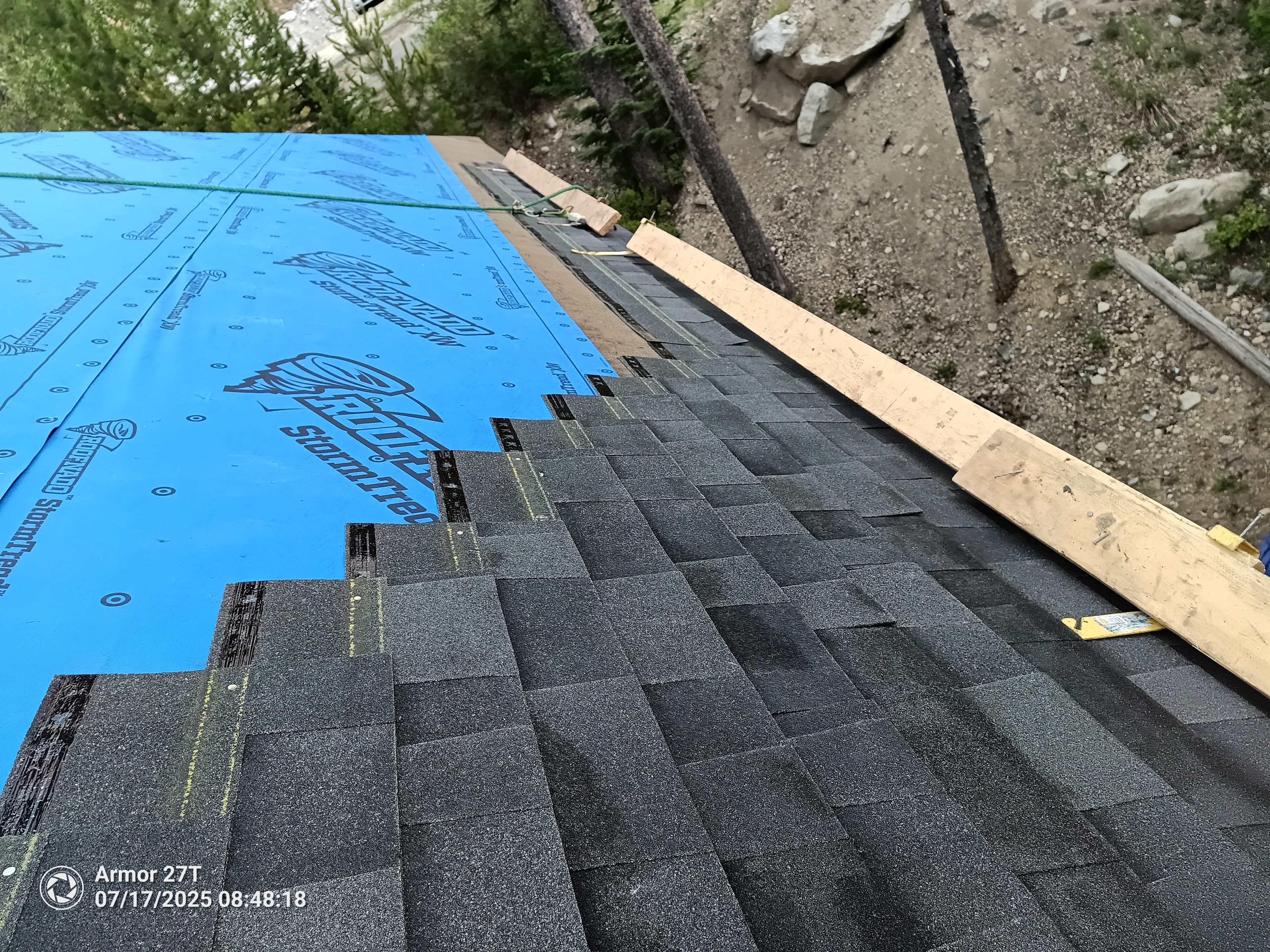 Roofing underlayment installation with blue StormTred membrane